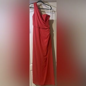 A Coralie red one shoulder dress.